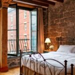 A signature king room at the Auberge du Vieux Port in Vieux Montreal.