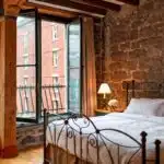 A signature king room at the Auberge du Vieux Port in Vieux Montreal.