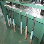 Selecting a bat at the Wood Bat Factory batting cages in Cooperstown, New York.