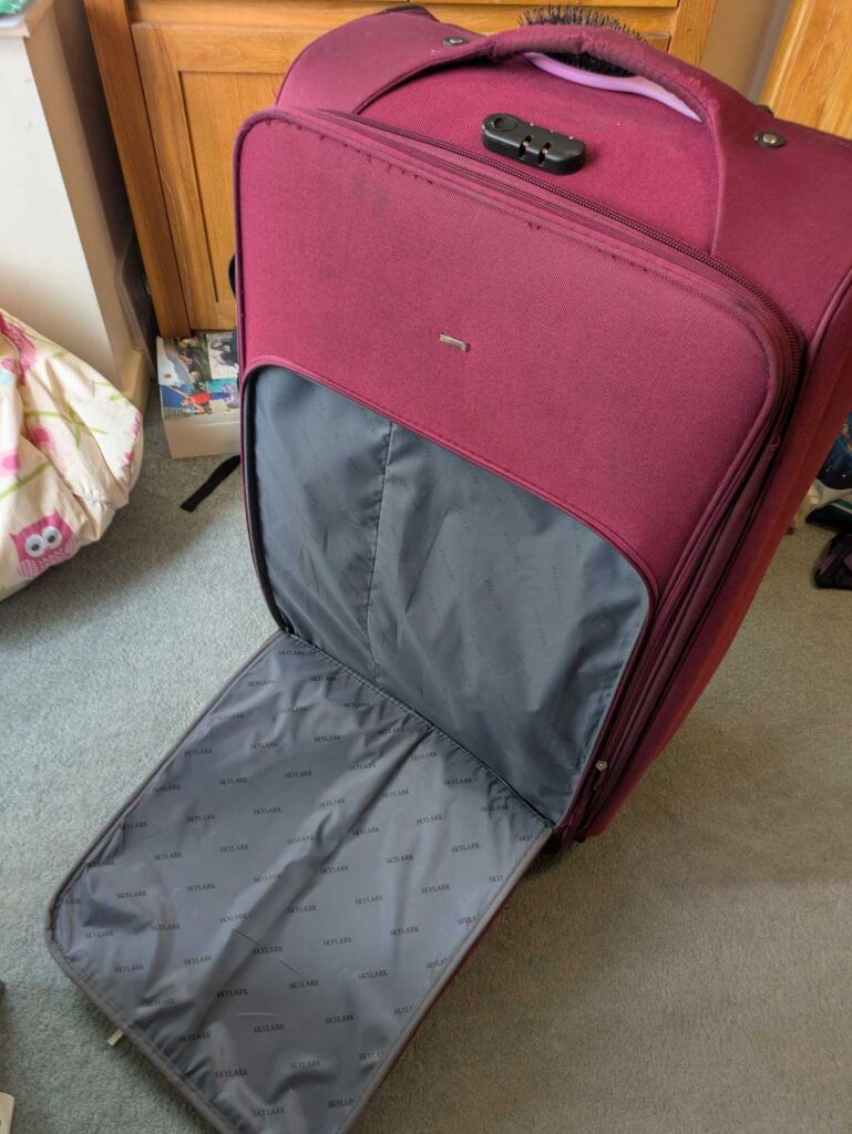 My poor, fatally wounded suitcase.
