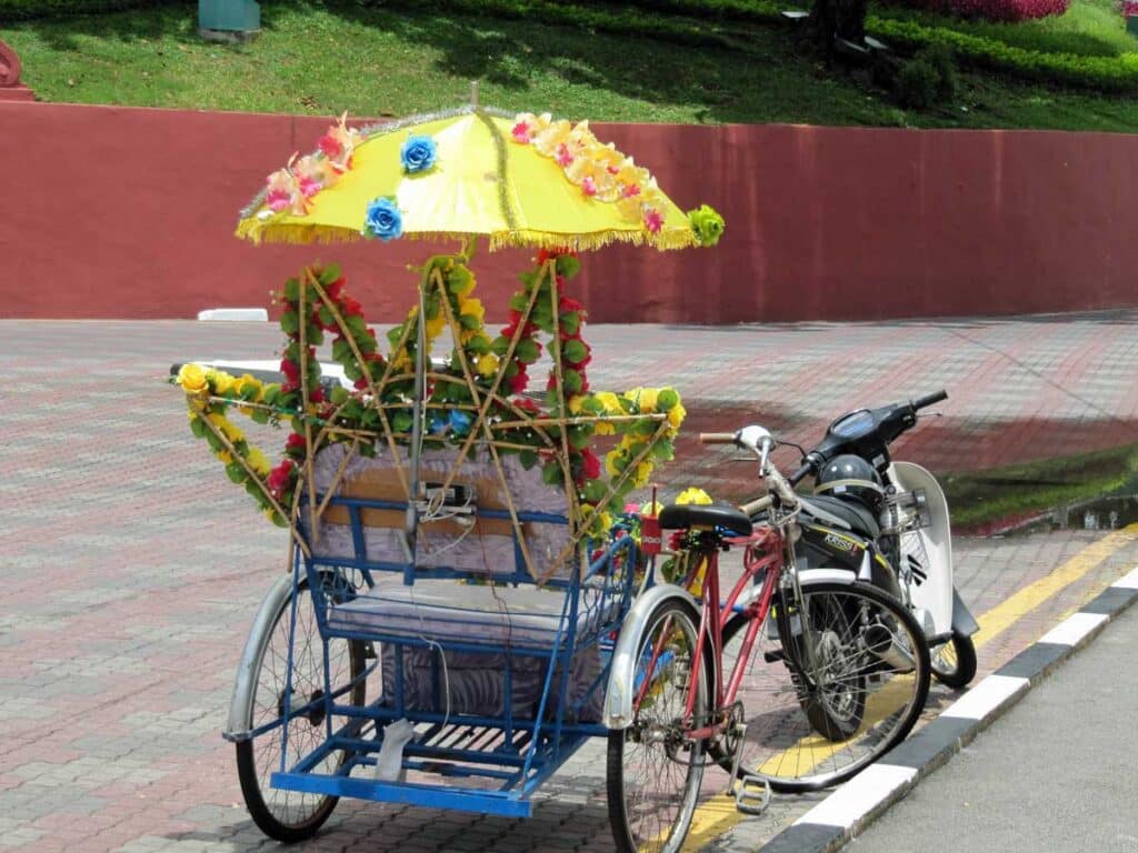 One of Melaka's colourful trishaws.
