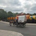 A horse and cart head past the fairground at the Black Country Living Museum in Dudley, West Midlands.