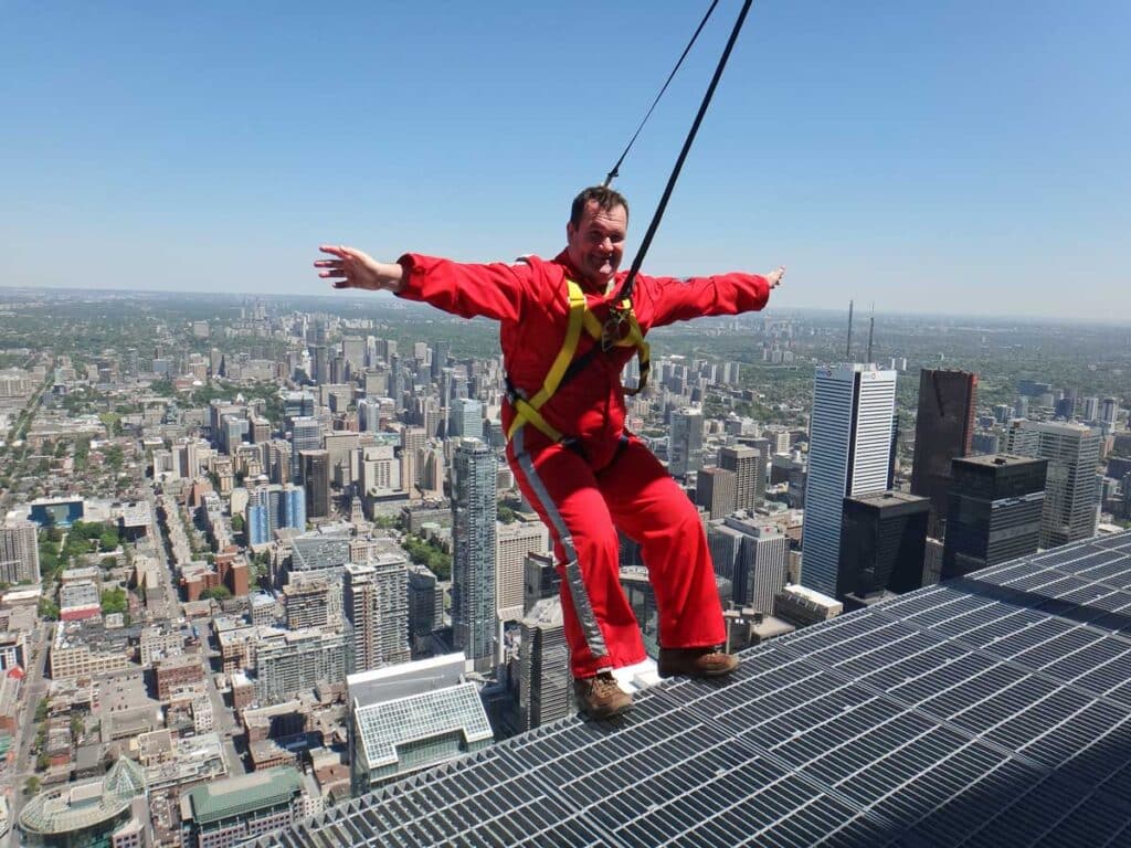 Leaning over the edge on the CN Tower Edgewalk in Toronto.