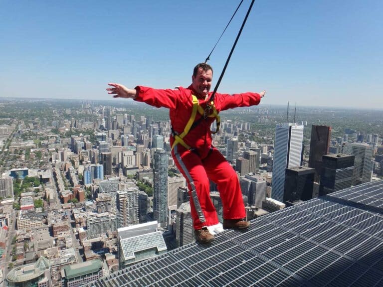 Leaning over the edge on the CN Tower Edgewalk in Toronto.