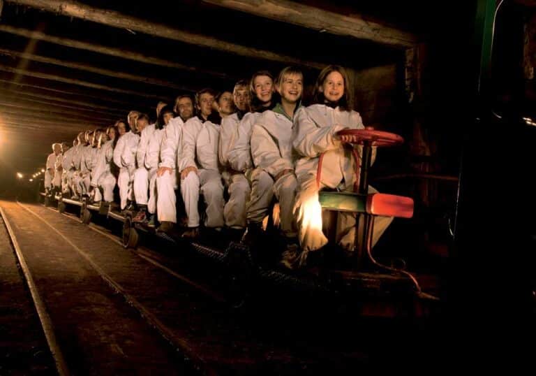 Entering the underground salt mine on a miniature train at Salzwelten near Salzburg.