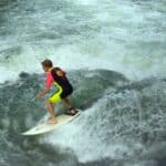 A surfer tackles Munich's Eisbach wave.