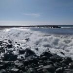 The Atlantic Ocean waves at Ribeira Brava Beach in Madeira, Portugal.