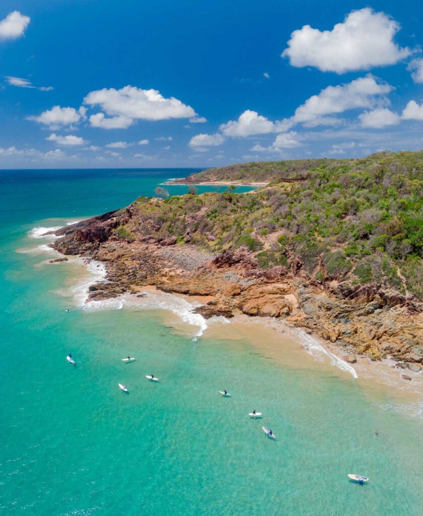 Paddleboarders off Agnes Water Main Beach in Queensland.