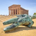 The broken Icarus statue at the base of the Temple of Concordia in Valley of Temples, Agrigento, Italy