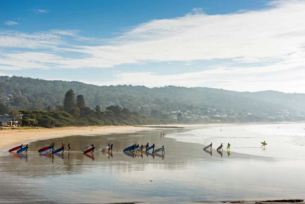 Surfers at Lorne Beach in Lorne, Victoria.