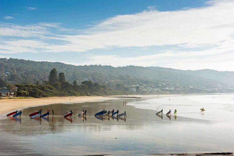 Surfers at Lorne Beach in Lorne, Victoria.